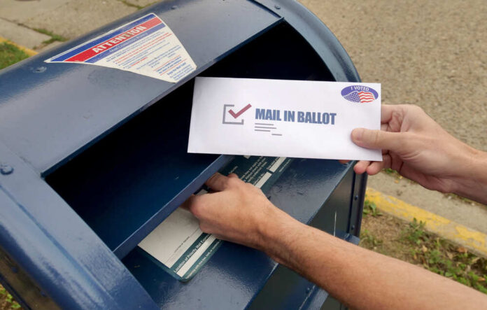 Circa,August,,2020,-,A,Man,Puts,An,Absentee,Mail-in Orlowski Designs LLC / shutterstock.com